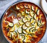 Ratatouille in a bowl topped with goat's cheese