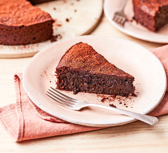 Flourless chocolate and almond cake sliced on a plate