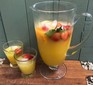 Fruit punch served in a jug and two glasses