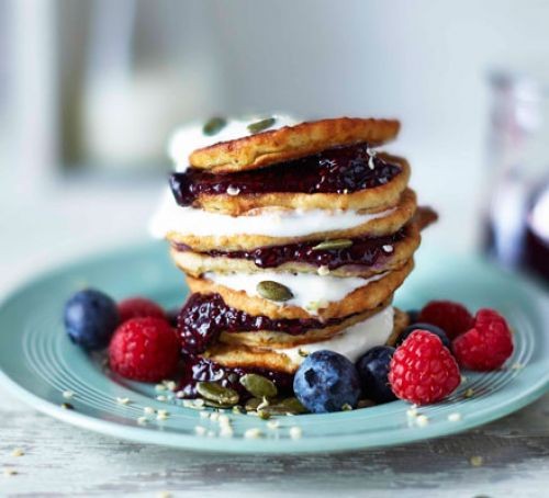 stack of pancakes with blueberries and raspberries