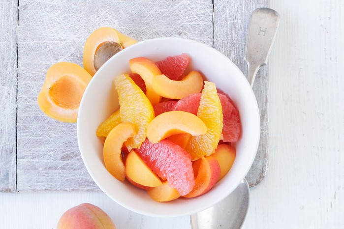 Grapefruit, orange & apricot salad in a bowl