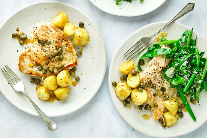 Chicken piccata served with new potatoes topped with capers