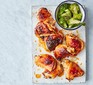 Honey & soy chicken thighs with sesame broccoli served on a board