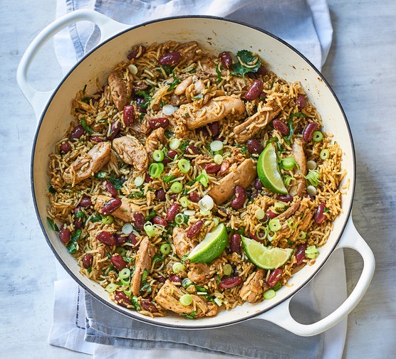 Jerk-style chicken pilaf in a white casserole dish