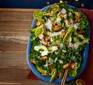 Kale caesar salad served on a blue plate