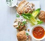 The ingredients for mango chutney & chicken sliders laid out on a board