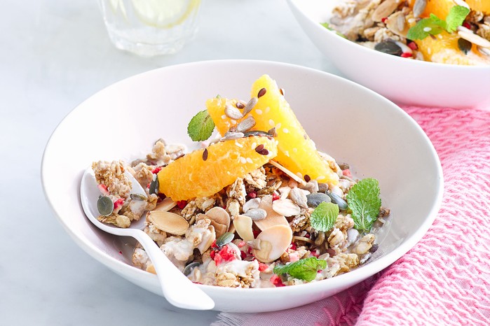 Granola topped with orange and raspberries