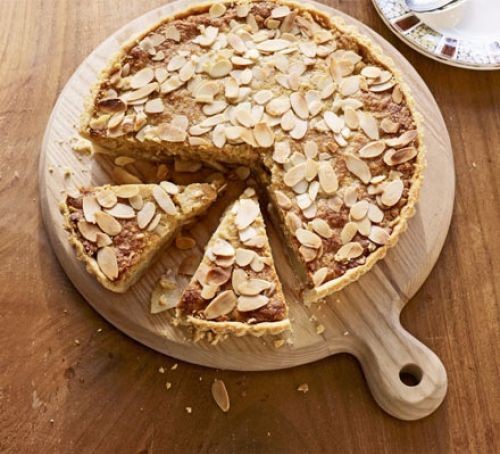 Almond and pear frangipane tart topped with flaked almonds