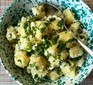 Potato salad in bowl with spoon