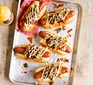 Pulled pork sloppy joe dogs served on a tray