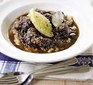 Beef bourguignon with celeriac mash in a bowl