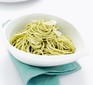 A bowl of spaghetti in pesto sauce