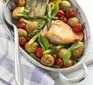 Salmon in a pot with potatoes and tomatoes