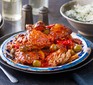 Slow cooker Spanish chicken on a rustic plate