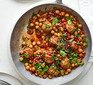 Spiced lamb meatball stew in a frying pan