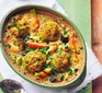 Spring veg stew with cheddar dumplings in a casserole dish